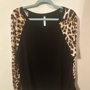 Chic Black Top with Leopard Print Sleeves